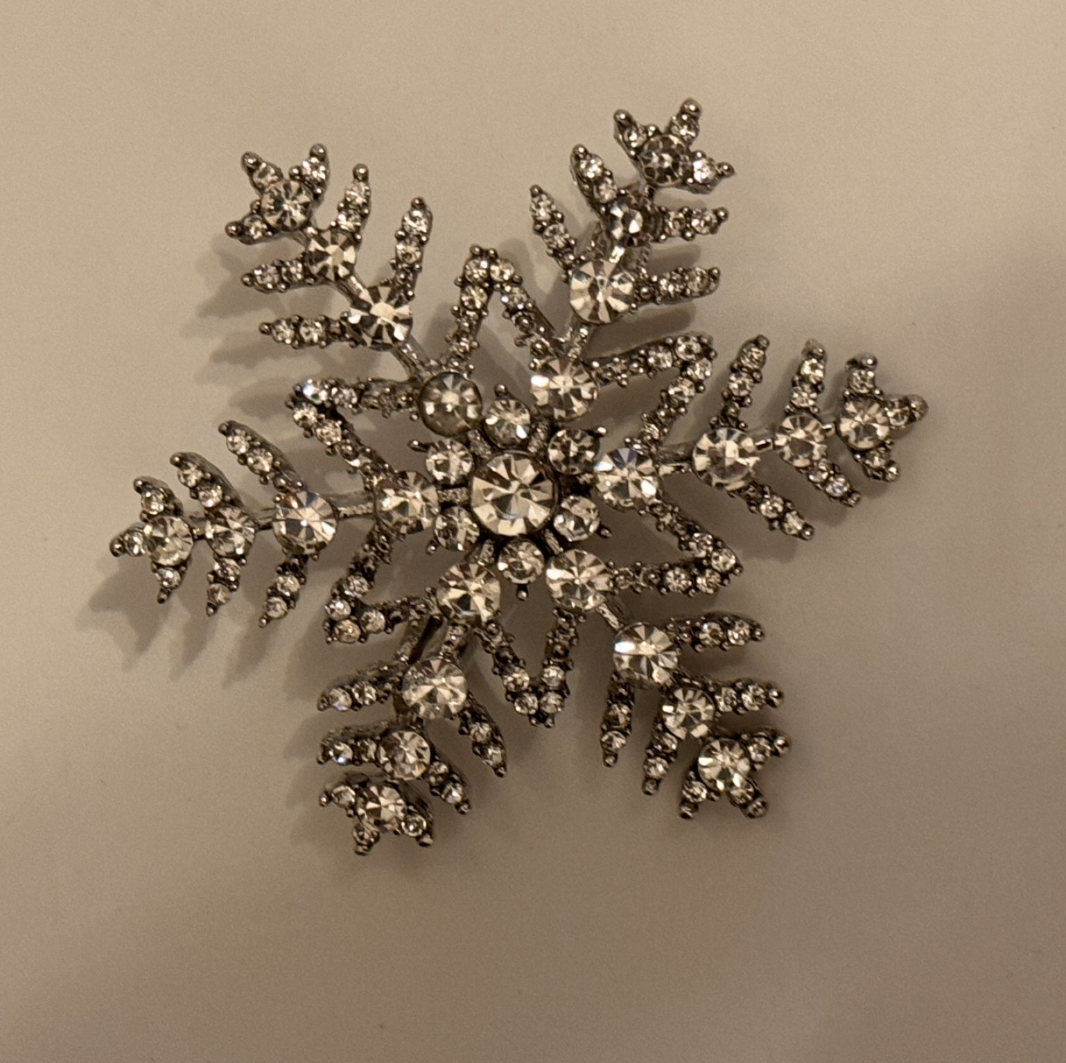 Metal snowflake brooch