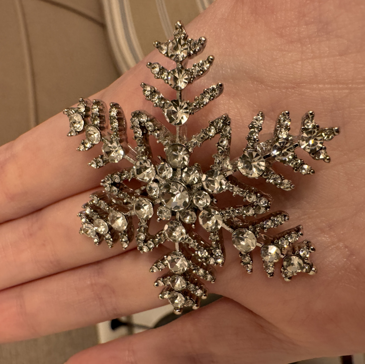 Metal snowflake brooch