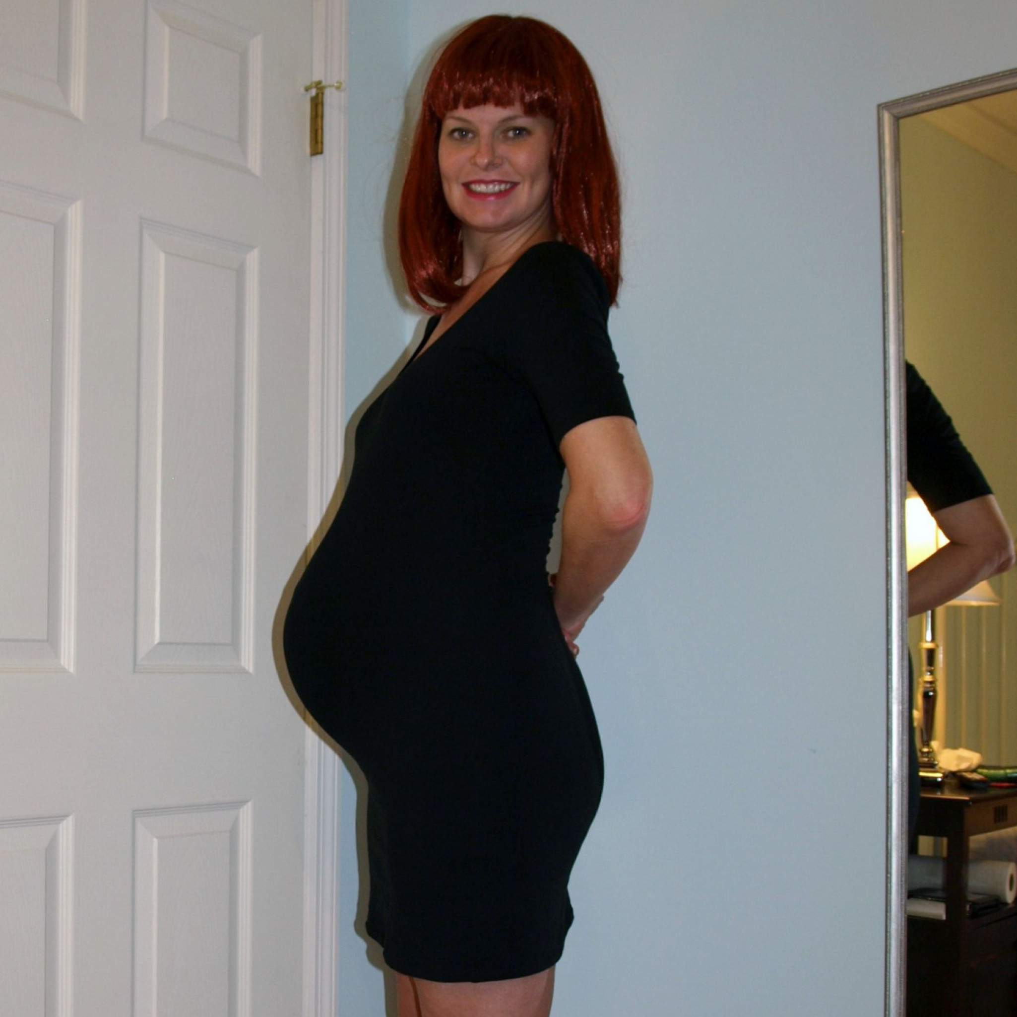 40 Pregnant Strip and posing 2011 black dress photos