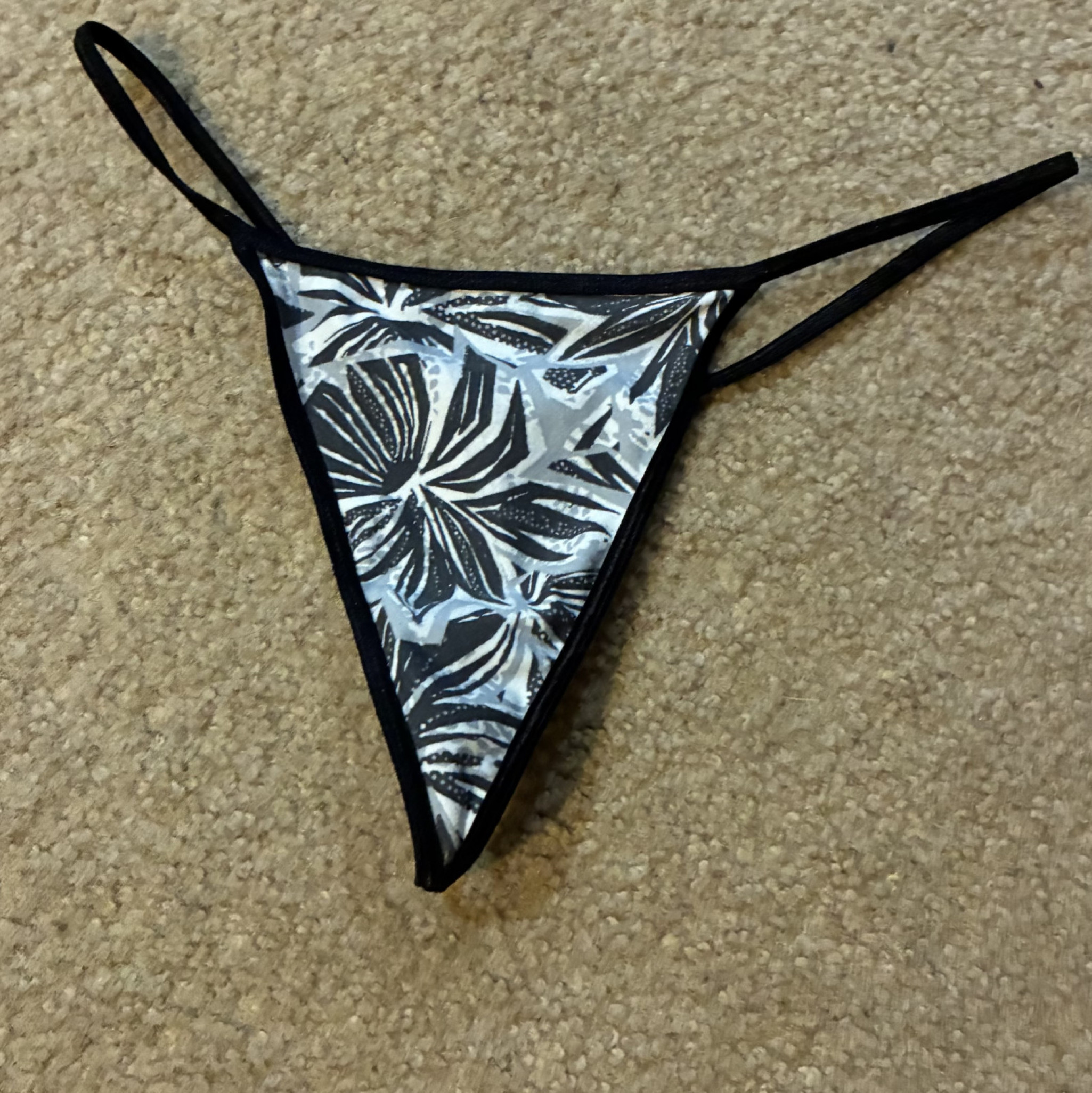 Used black and white flower g string