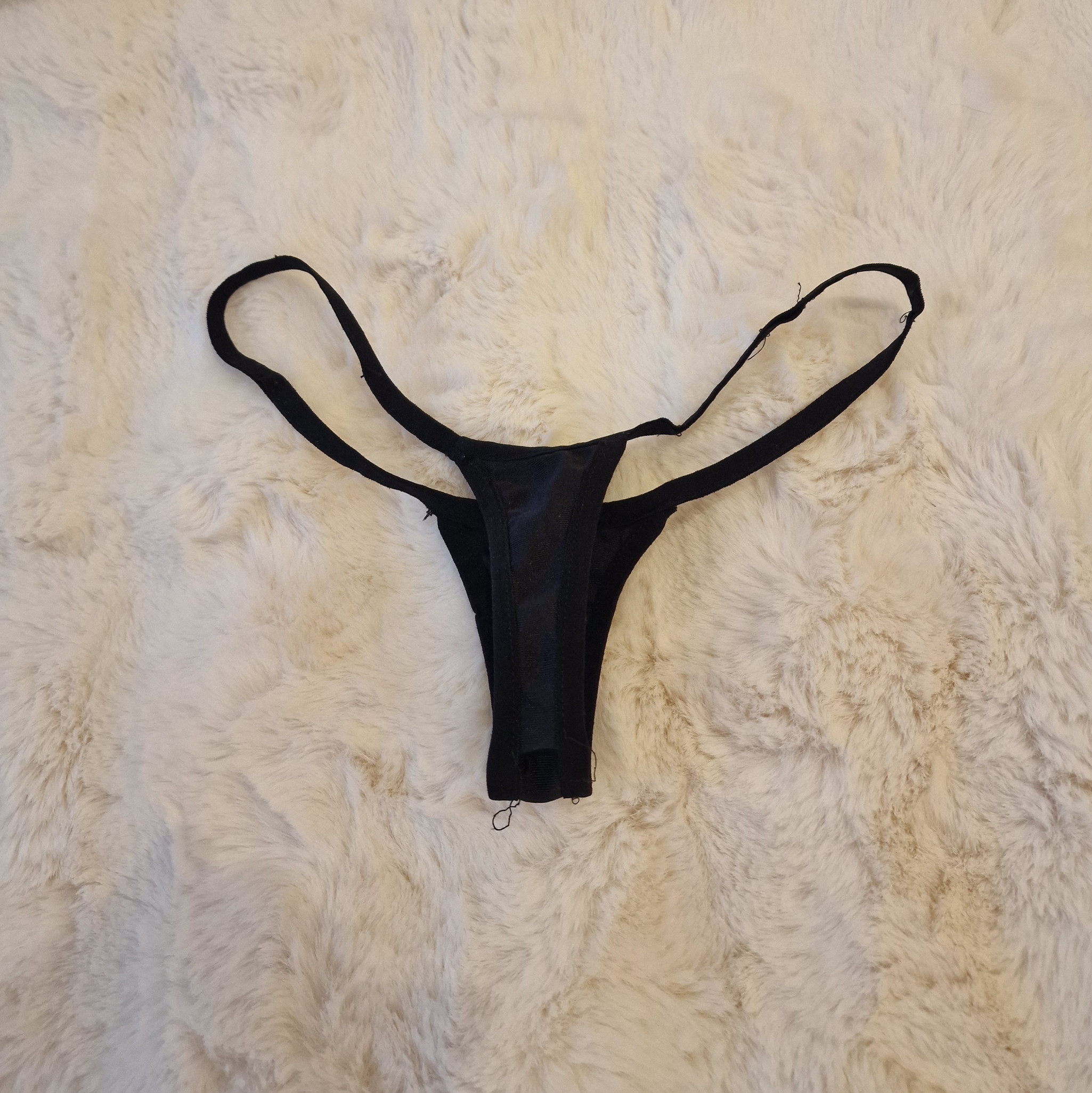 Black micro thongs