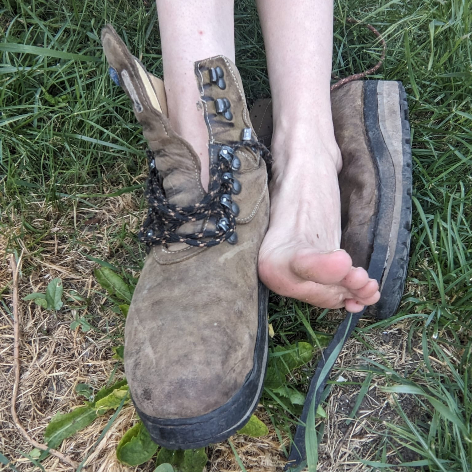 Heavily worn brown leather orthopaedic shoes