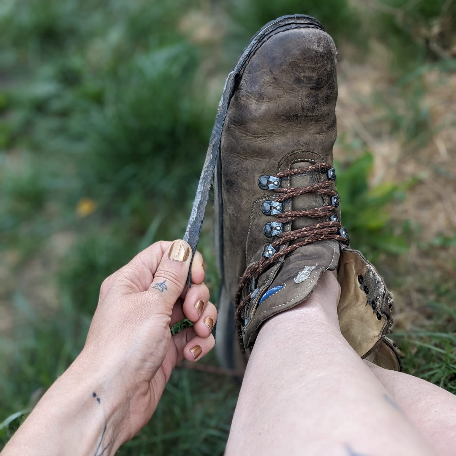 Heavily worn brown leather orthopaedic shoes