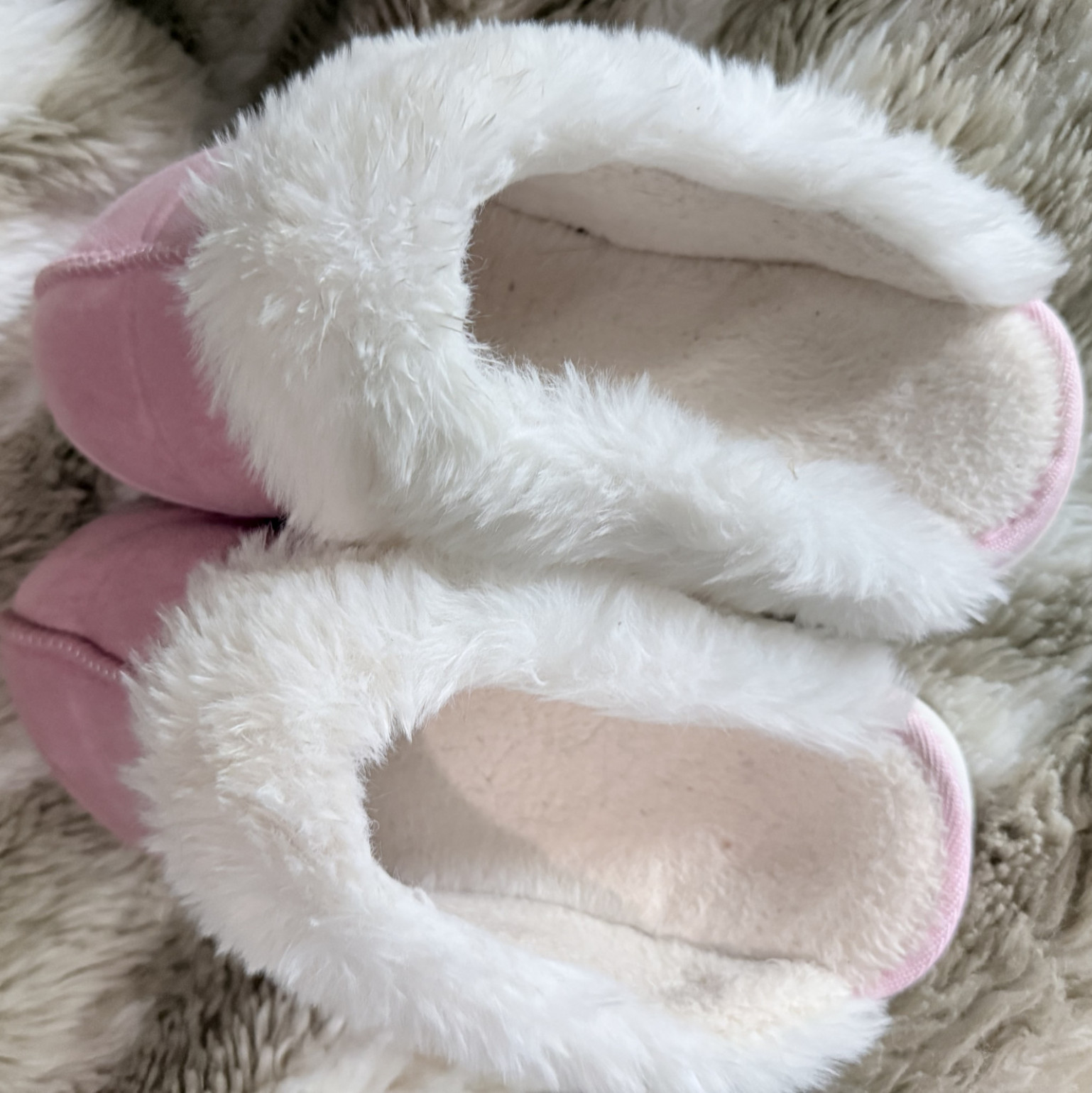 Worn pink fluffy slippers