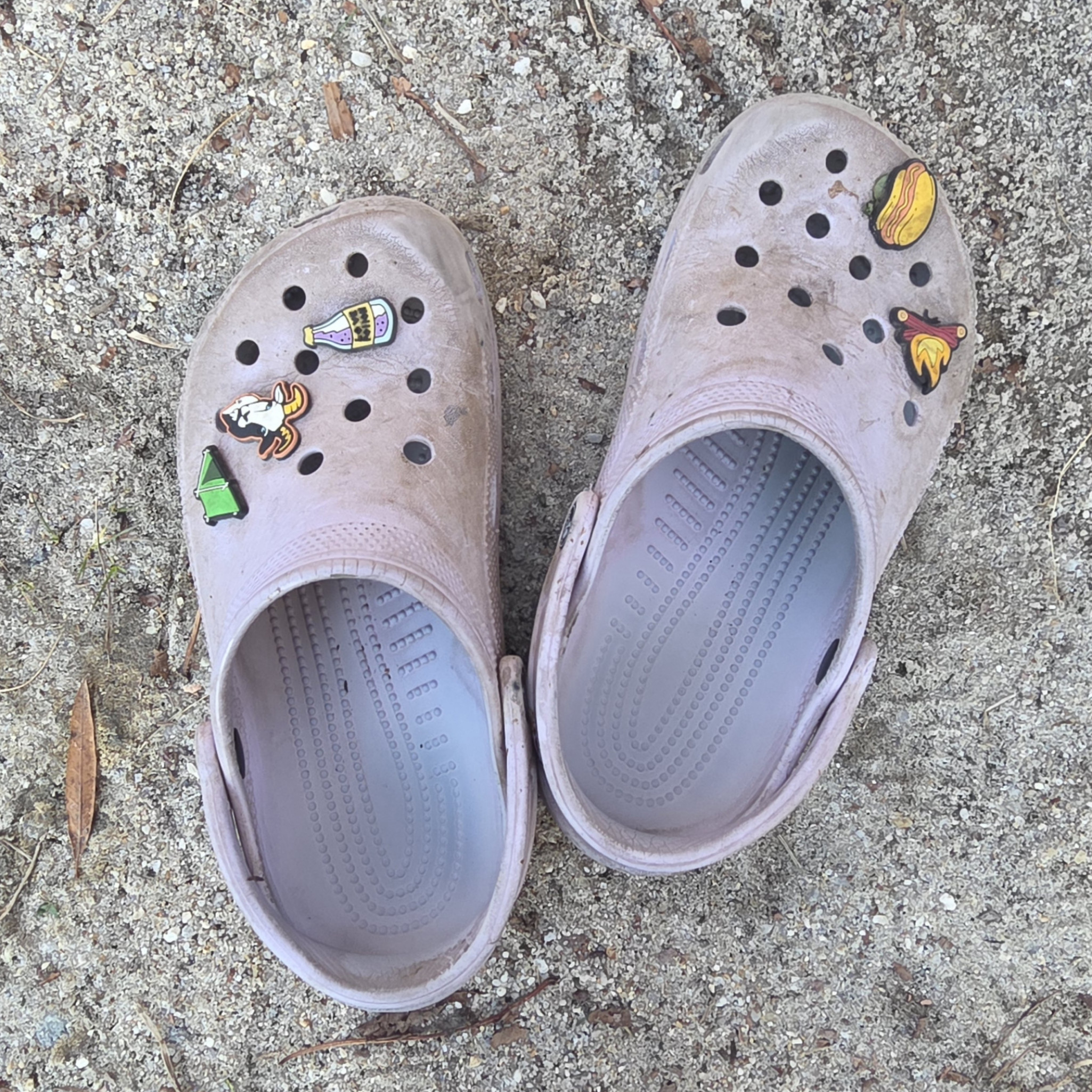 Worn Purple Crocs with Charms