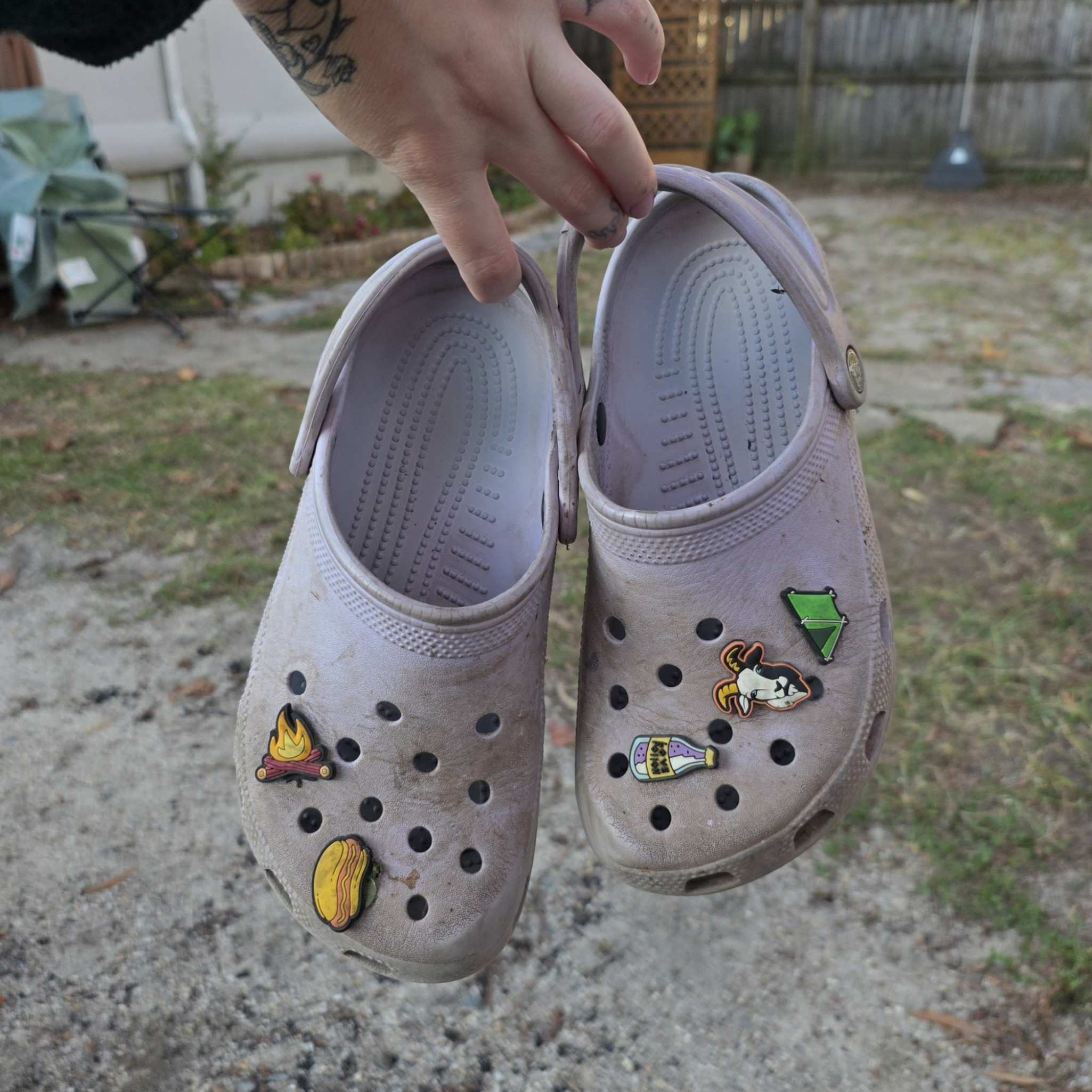 Worn Purple Crocs with Charms