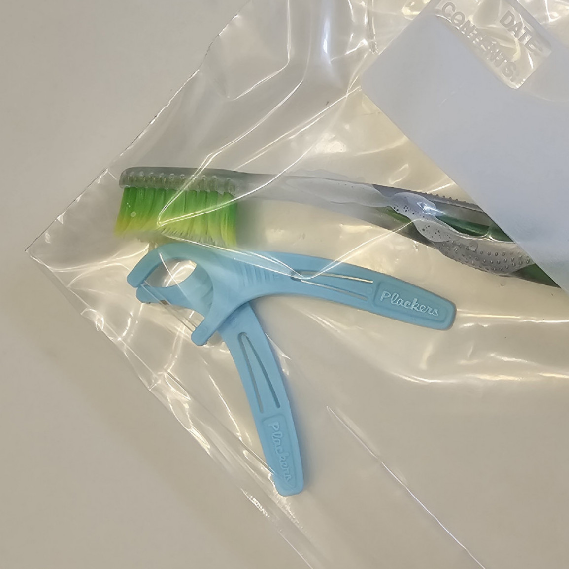 Toothbrush and floss