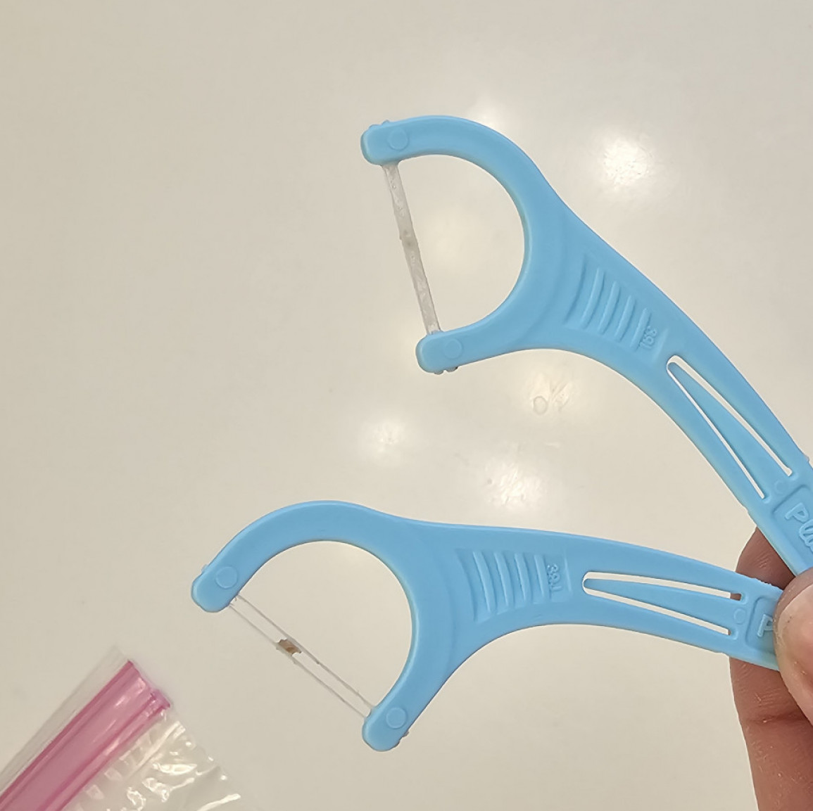 Toothbrush and floss