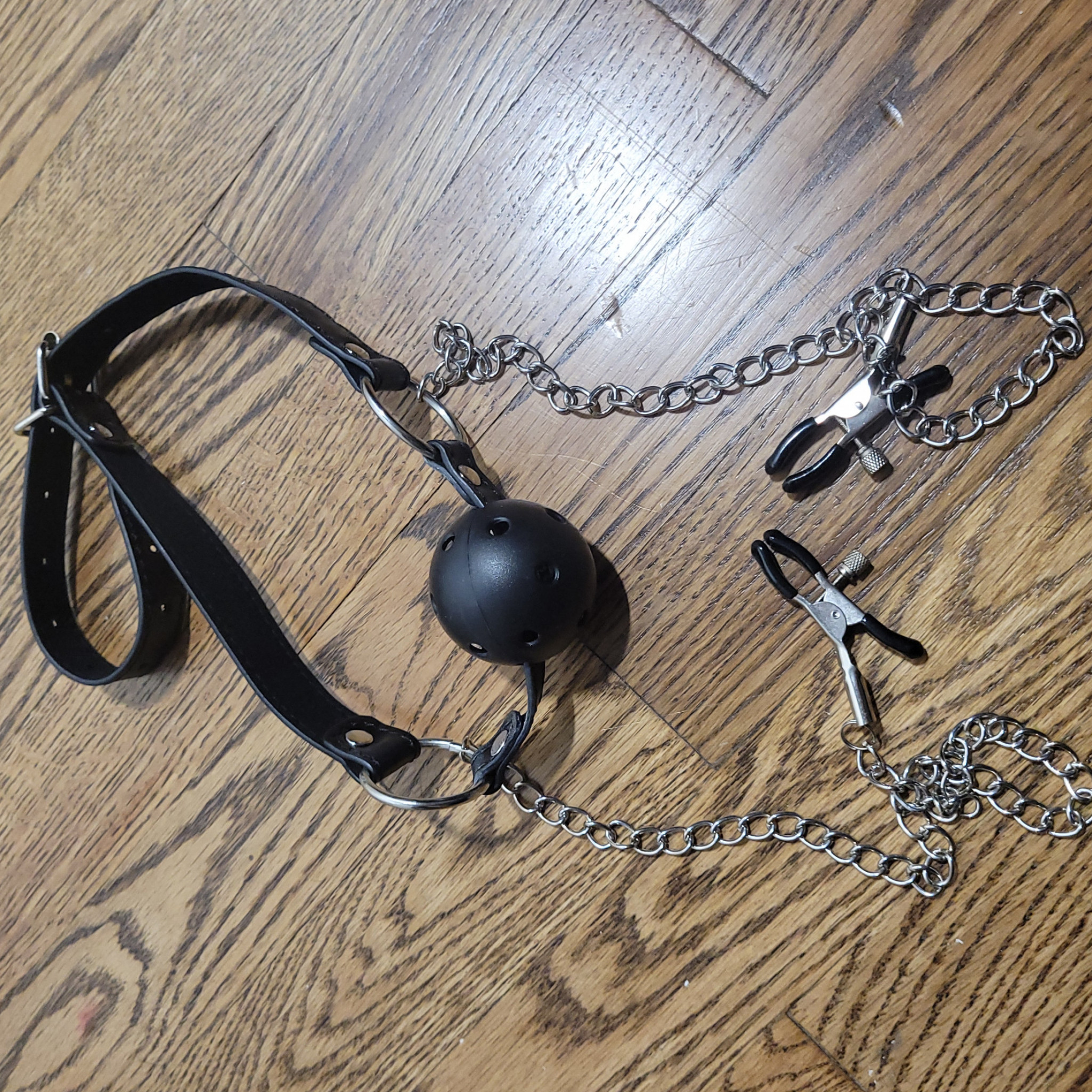Worn Ball Gag with Chained Nipple Clamps