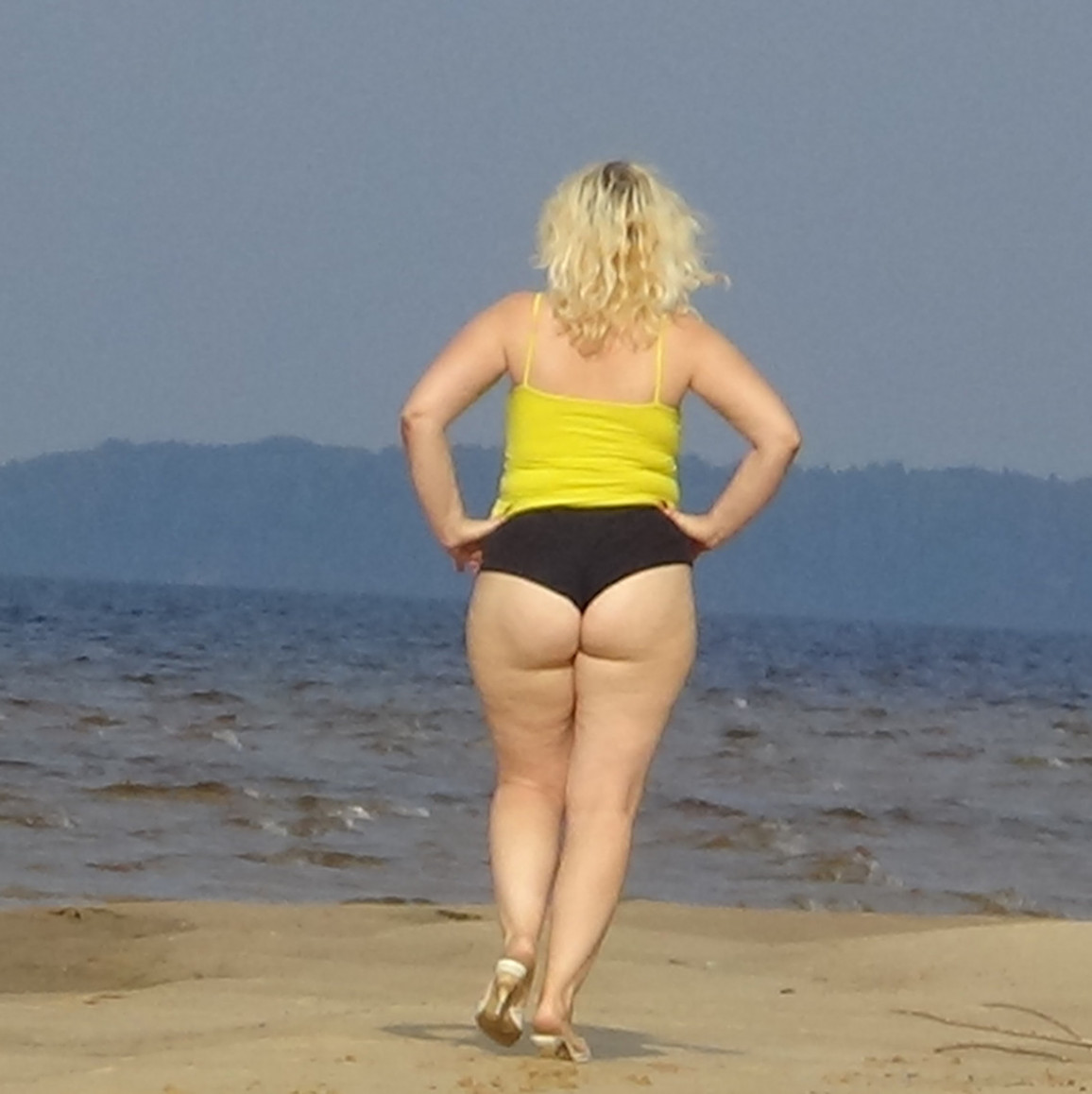 Big ass in mini shorts   Walk on beach