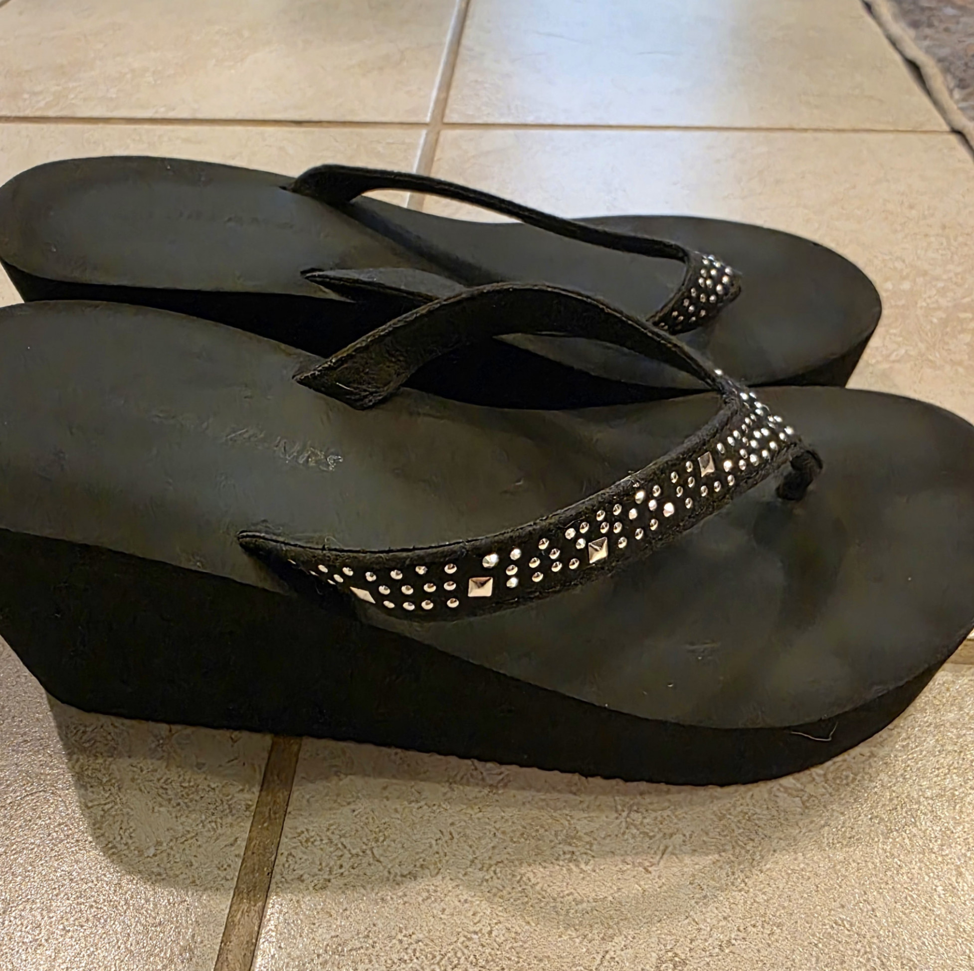 Worn platforms flip flops