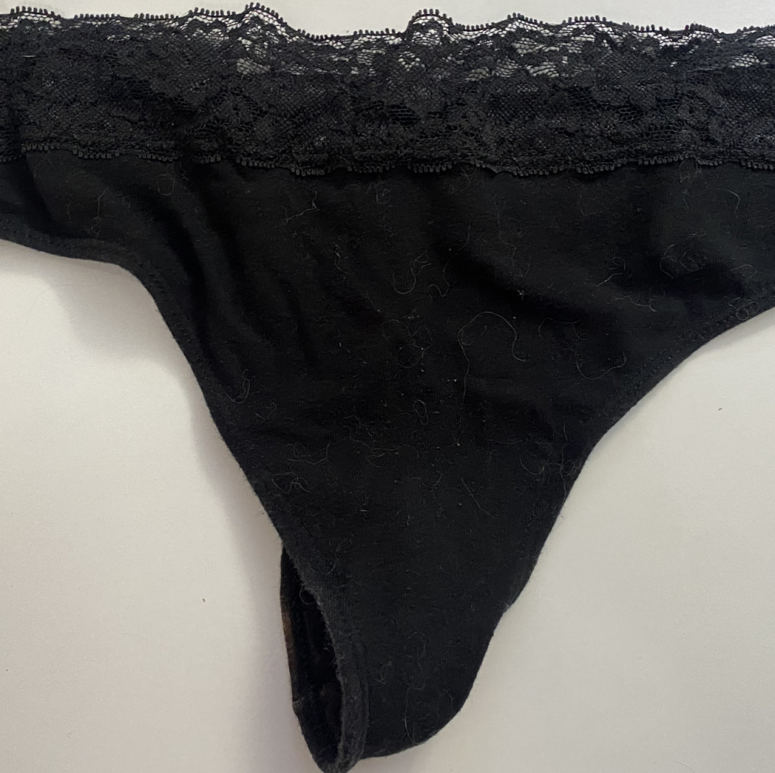 Worn black thong