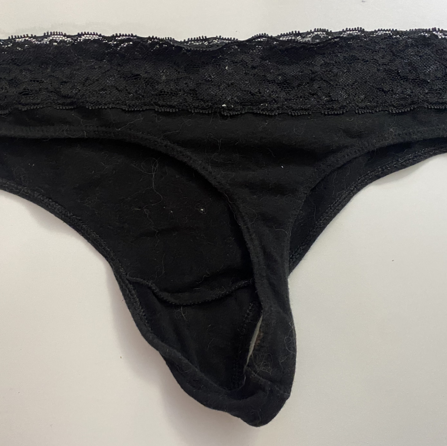 Worn black thong
