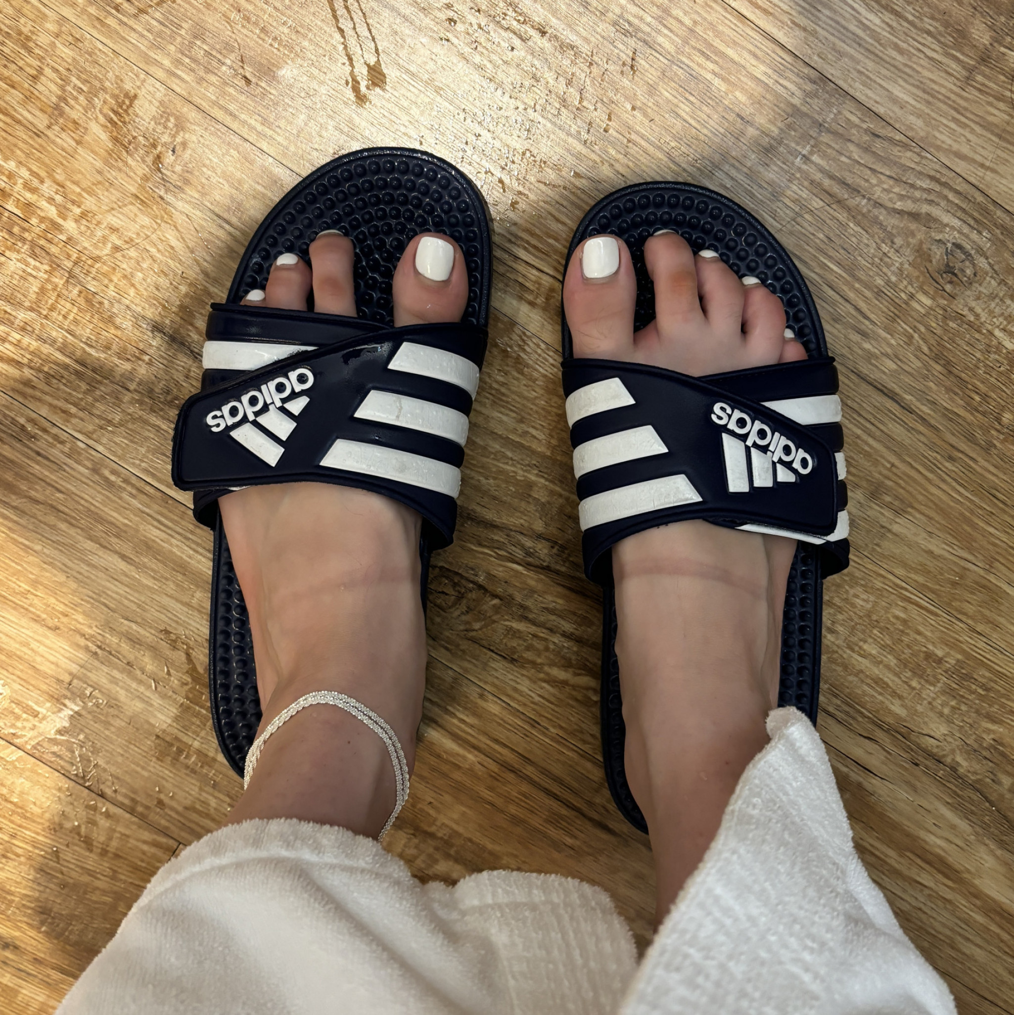 blue adidas gym slides worn