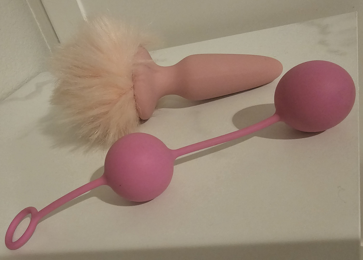 used pink silicone rabbit tail buttplug and ben wa beads