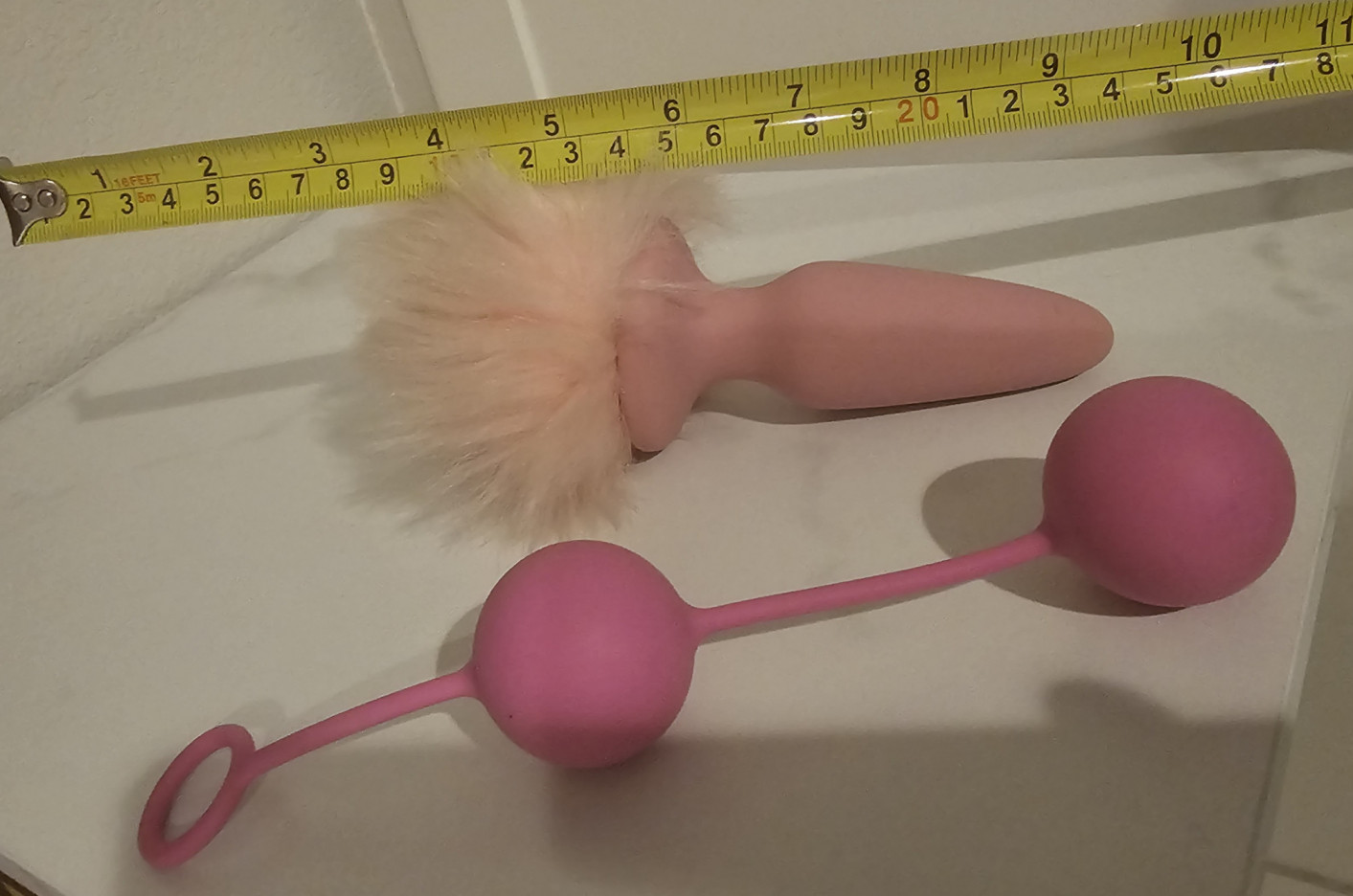 used pink silicone rabbit tail buttplug and ben wa beads
