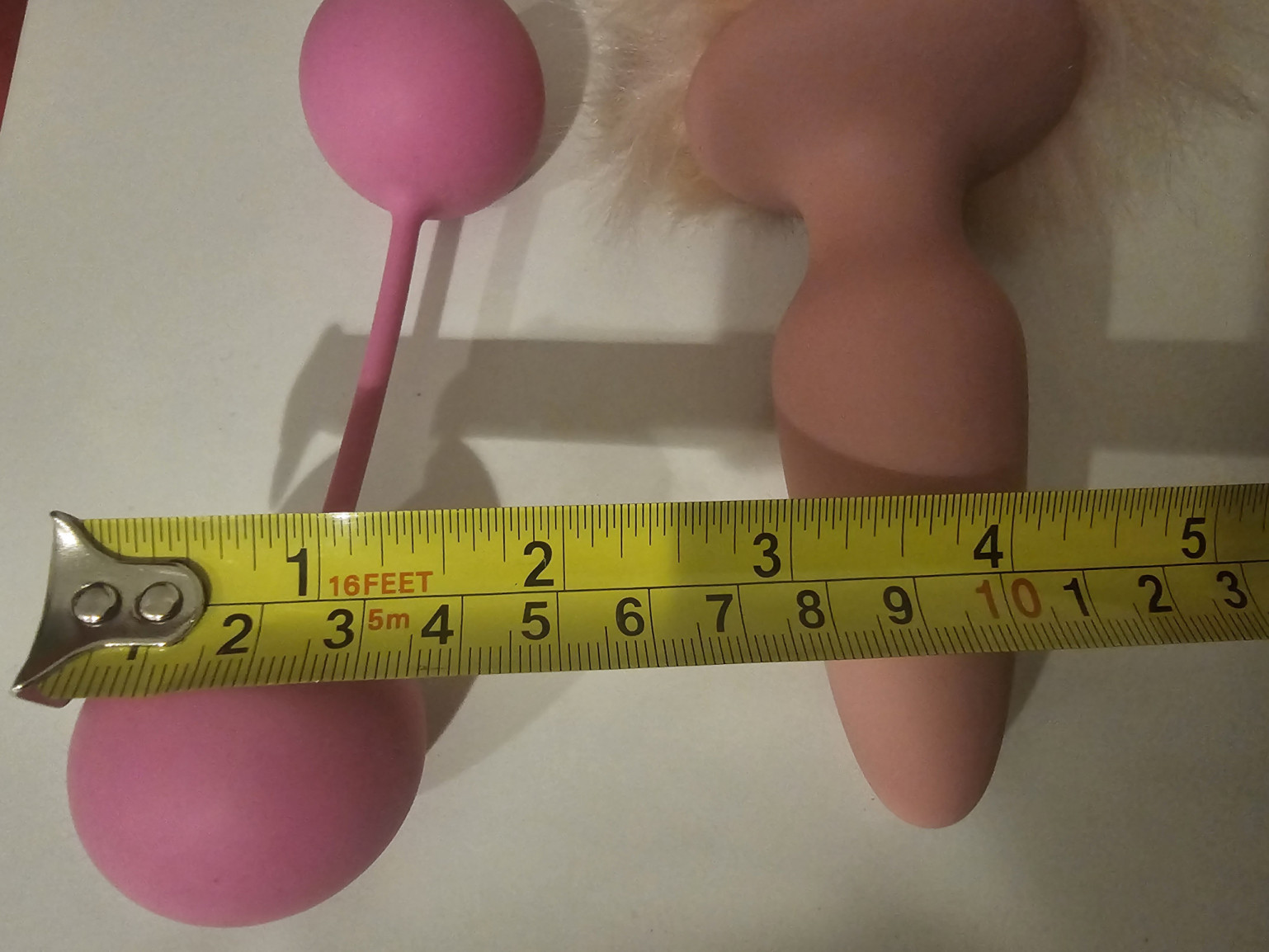 used pink silicone rabbit tail buttplug and ben wa beads